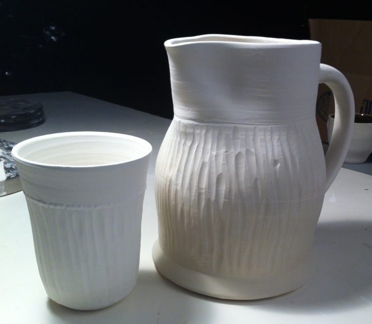 carved pitcher and cup